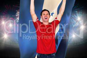 Composite image of cheering football fan in red