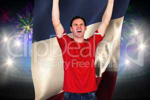 Composite image of cheering football fan in red