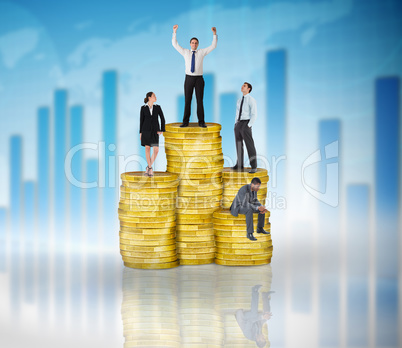 Composite image of business people on pile of coins