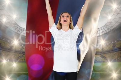 Composite image of cheering football fan in white holding russia