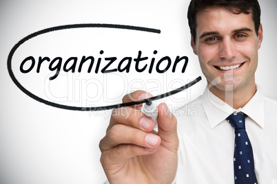 Businessman writing the word organization
