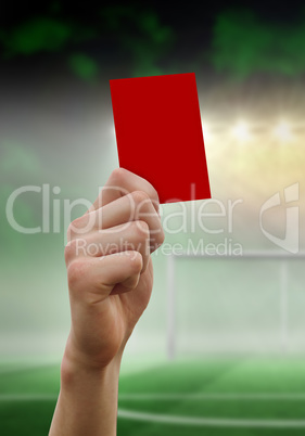 Composite image of hand holding up red card