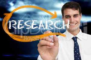 Businessman writing the word research