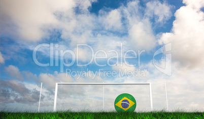 Composite image of football in brasil colours