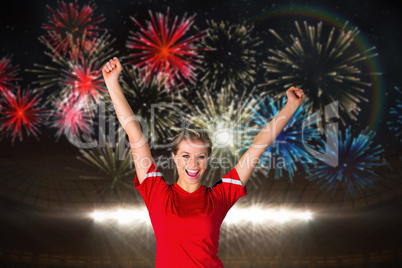 Composite image of cheering football fan in red