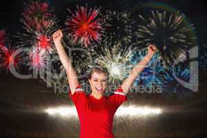 Composite image of cheering football fan in red