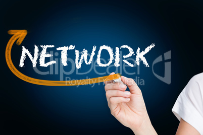 Businesswoman writing the word network