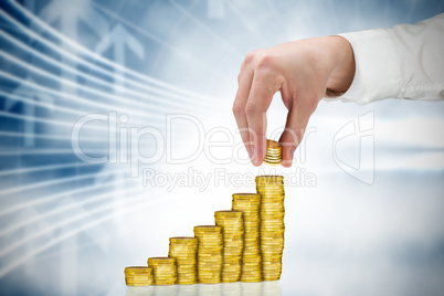 Composite image of businessman holding coins