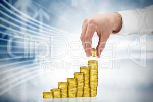 Composite image of businessman holding coins