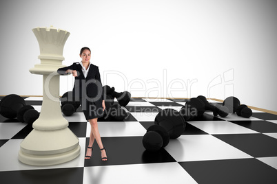 Composite image of young businesswoman standing and leaning