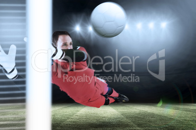 Composite image of fit goal keeper jumping up