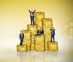 Composite image of business people on pile of coins