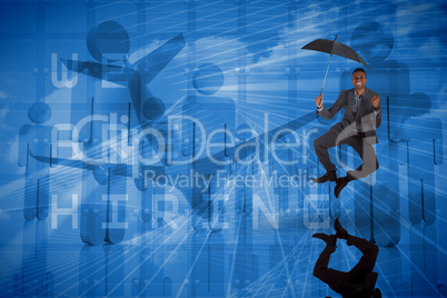 Composite image of businessman cheering and holding umbrella