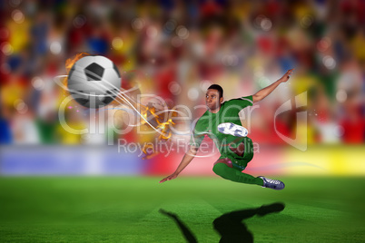 Composite image of football player in green kicking