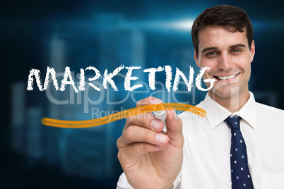 Businessman writing the word marketing