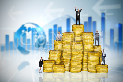 Composite image of business people on pile of coins