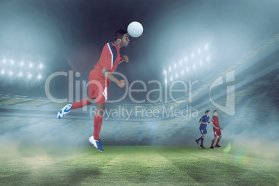 Composite image of football player in red jumping