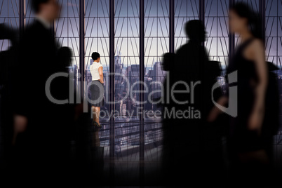 Composite image of business people walking in a blur