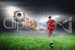 Composite image of football player in red kicking