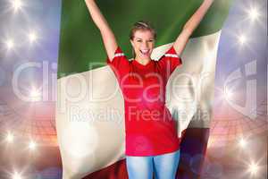 Composite image of cheering football fan in red holding italy fl
