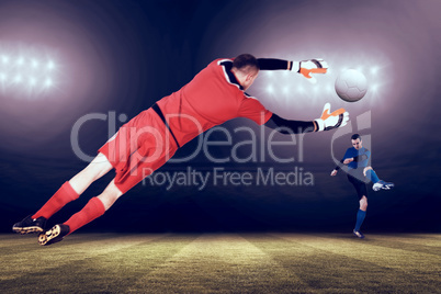 Composite image of fit goal keeper jumping up