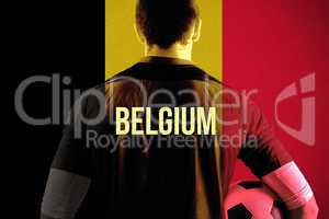 Composite image of belgium football player holding ball