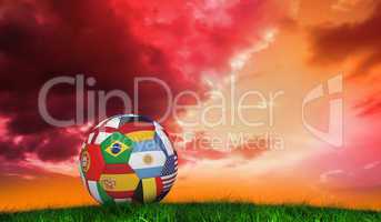 Composite image of football in multi national colours