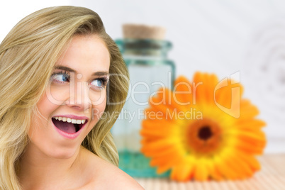 Composite image of smiling blonde natural beauty