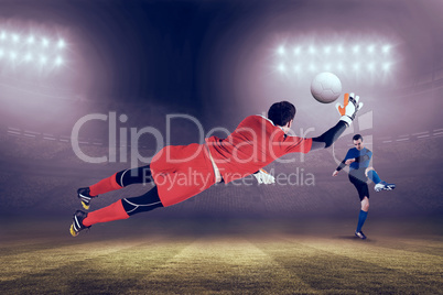 Composite image of fit goal keeper jumping up