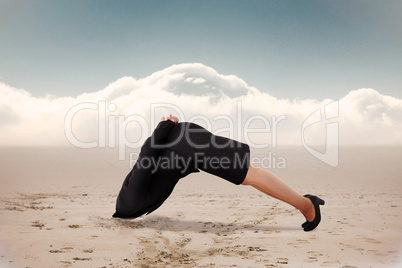 Composite image of businesswoman burying her head
