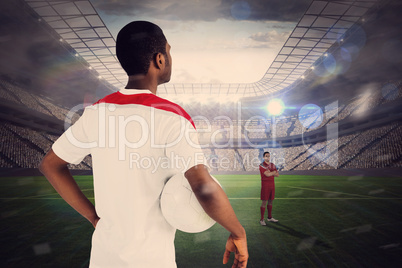 Football players facing off in large stadium