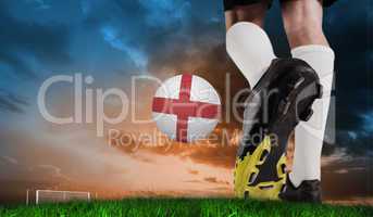 Composite image of football boot kicking england ball