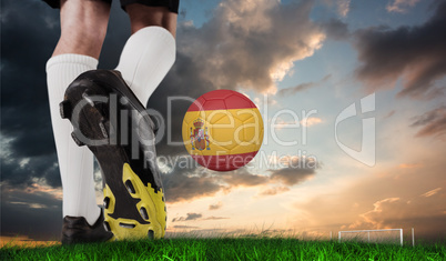 Composite image of football boot kicking spain ball