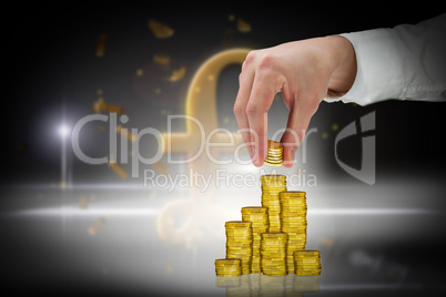 Composite image of businessman holding coins