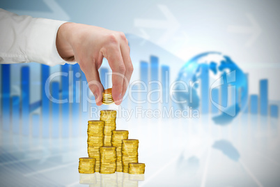 Composite image of businessman holding coins