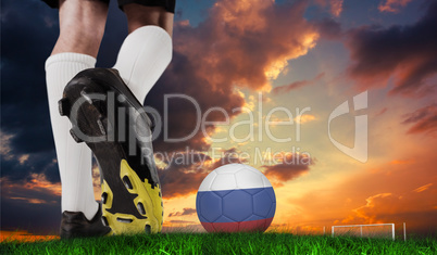 Composite image of football boot kicking russia ball