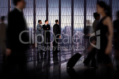 Composite image of business colleagues looking