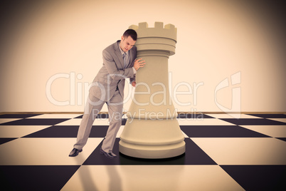 Composite image of portrait of a handsome businessman pushing ch