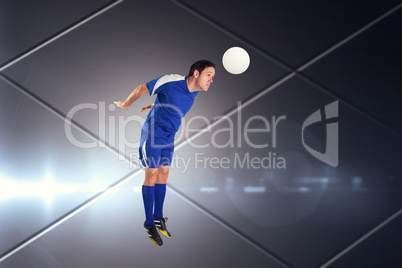 Composite image of football player in blue jumping