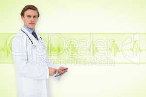 Composite image of young doctor using tablet pc