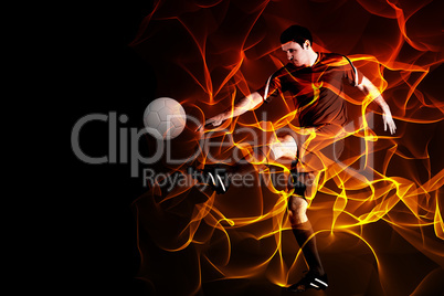 Composite image of football player in red kicking