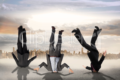 Composite image of business people burying their heads