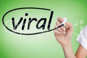 Businesswoman writing the word viral