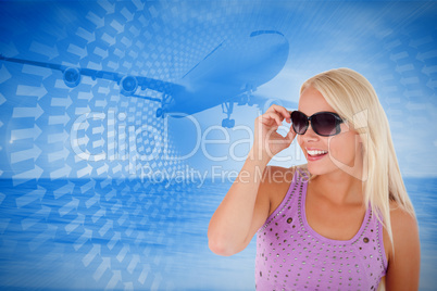 Composite image of blond woman with sunglasses