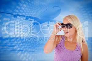 Composite image of blond woman with sunglasses