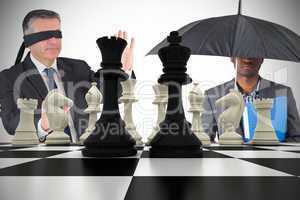 Composite image of businessmen with chessboard