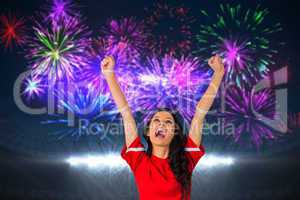 Composite image of cheering football fan in red