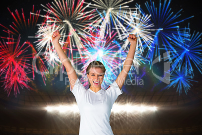 Composite image of pretty football fan in white cheering