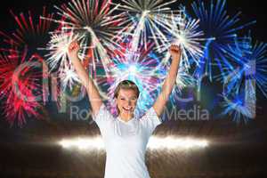 Composite image of pretty football fan in white cheering