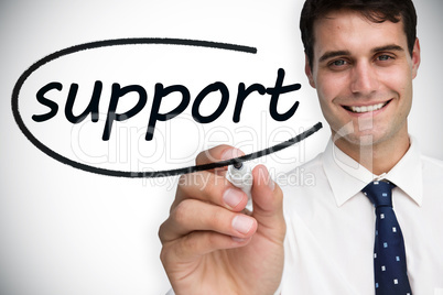 Businessman writing the word support